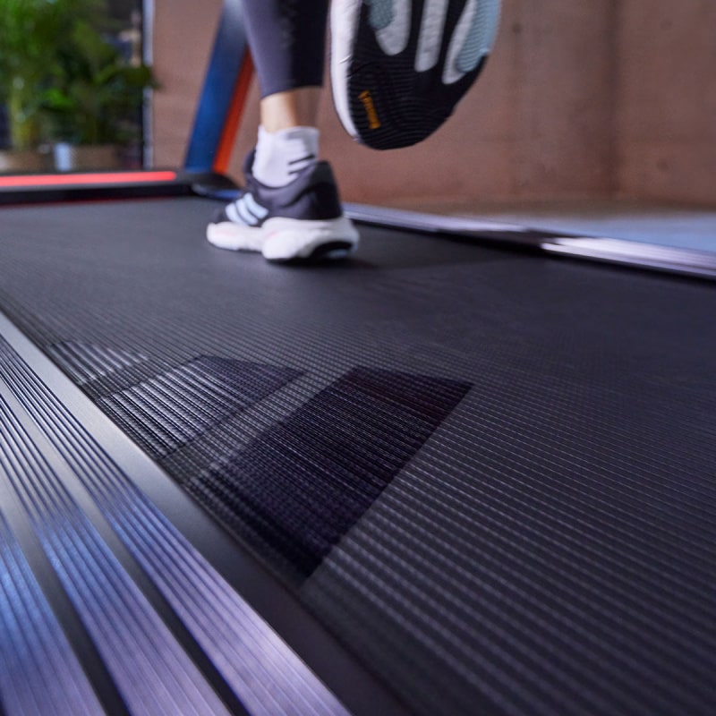 adidas t23 treadmill running low angle view