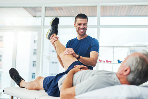 Portable massage table therapist treating patient